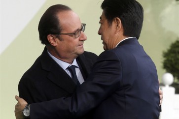الرئيس الفرنسي فرنسوا هولاند ورئيس الوزراء الياباني شينزو ابي