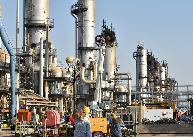 (FILES) This file photo taken on September 20, 2019 shows employees of Aramco oil company working in Saudi Arabia's Abqaiq oil processing plant. - Saudi Aramco shares hit the lowest level since their market debut today, as Gulf bourses were hit by a panicky sell-off amid Iranian vows of retaliation over the US killing of a top general.
All seven bourses in the Gulf Cooperation Council (GCC) states closed in the red, on the first trading day since the death of powerful military commander Qasem Soleimani. (Photo by Fayez Nureldine / AFP)