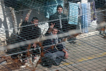 Palestinian prisoners, convicted of security offenses against Israel, are seen at the courtyard in Megido jail, northern Israel February 15, 2005. Israel's cabinet approved the release of 500 Palestinian prisoners as a goodwill gesture towards Palestinian President Mahmoud Abbas, government officials said. (Photo by Lior Mizrahi/Getty Images)